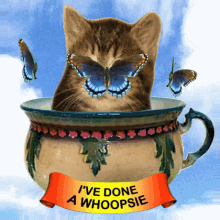 Cat in a Teapot with Butterflies Around It GIF