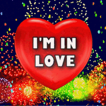 Red Heart with I'M IN LOVE and Colorful Fireworks GIF
